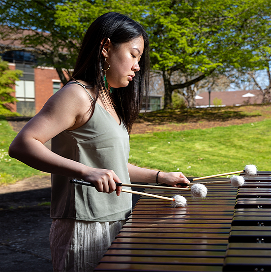 Percussionist playing outside