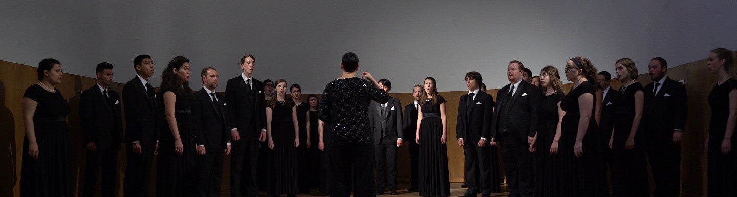 Conductor turned away while choir is performing