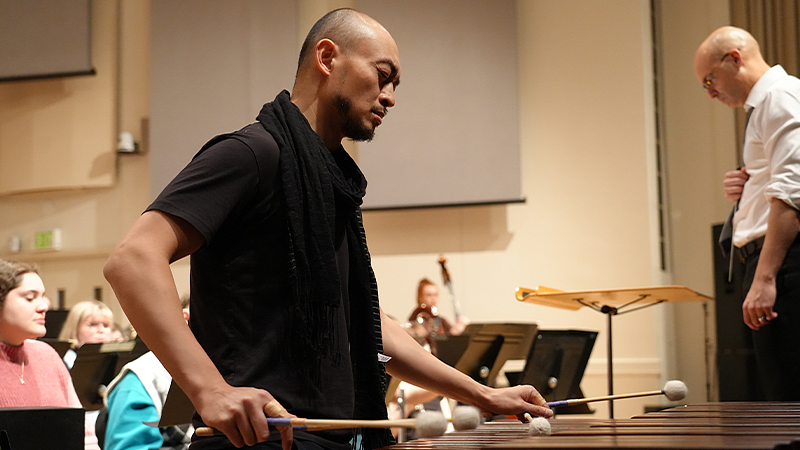 Pius C on percussion rehearsing