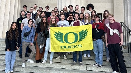 UOCC group photo with flag