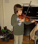 alfonso-playing-violin-as-a-child.jpeg