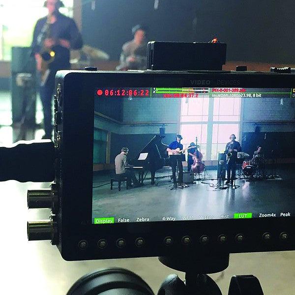 Camera recording a group performance