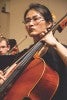 Student playing instrument in group